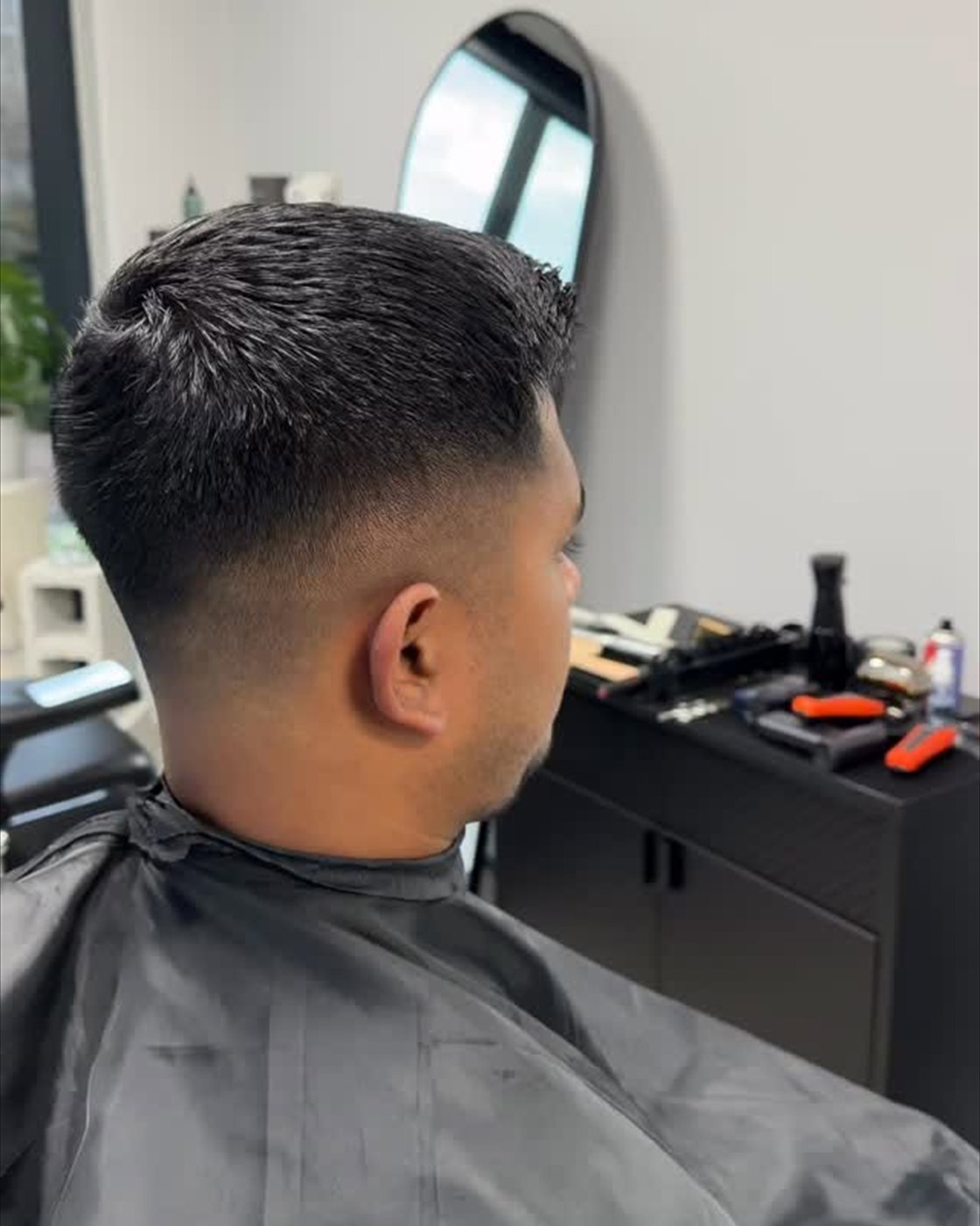Close rear view of a clean low fade